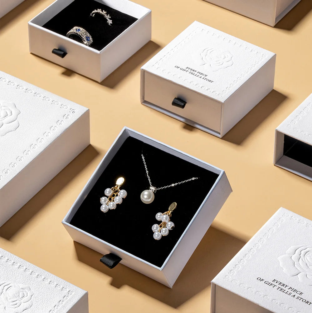 white luxury jewelry packaging with embossing rose