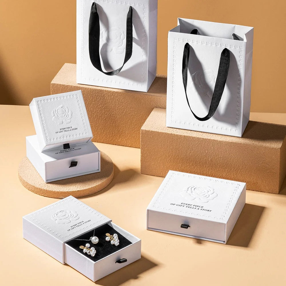 white luxury jewelry packaging with embossing rose
